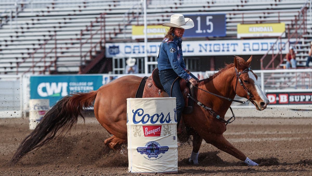 Andrea Busby turns on a red horse at Caldwell