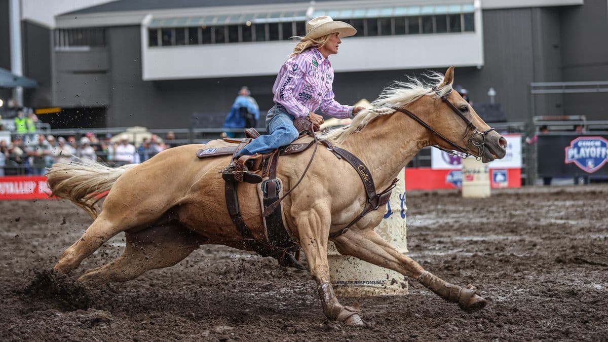 Carlee Otero turns a barrel on her beautiful yellow mare Regina