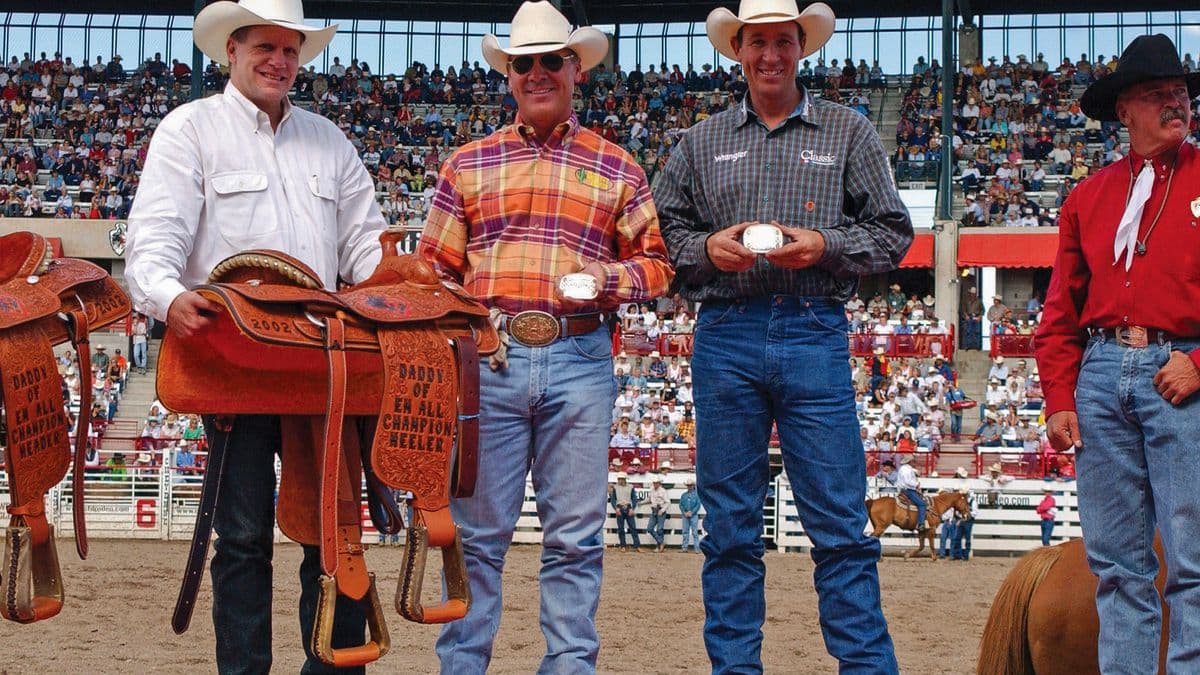 Jake Barnes and Clay O'Brien Cooper team roping at Cheyenne Frontier Days in 2002