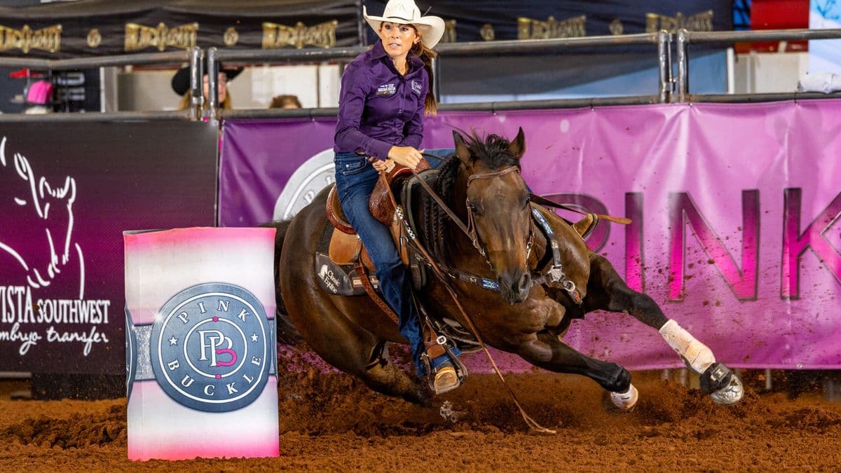 Kassie Mowry and Jarvis turn a barrel
