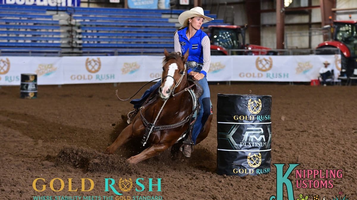 Taylor Miniat turns a barrel on a red horse