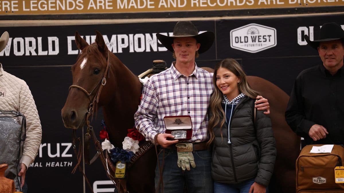 Sylais York holds a trophy buckle beside Dainty Rey Cat at the Old West World Championships in Amarillo, Texas.
