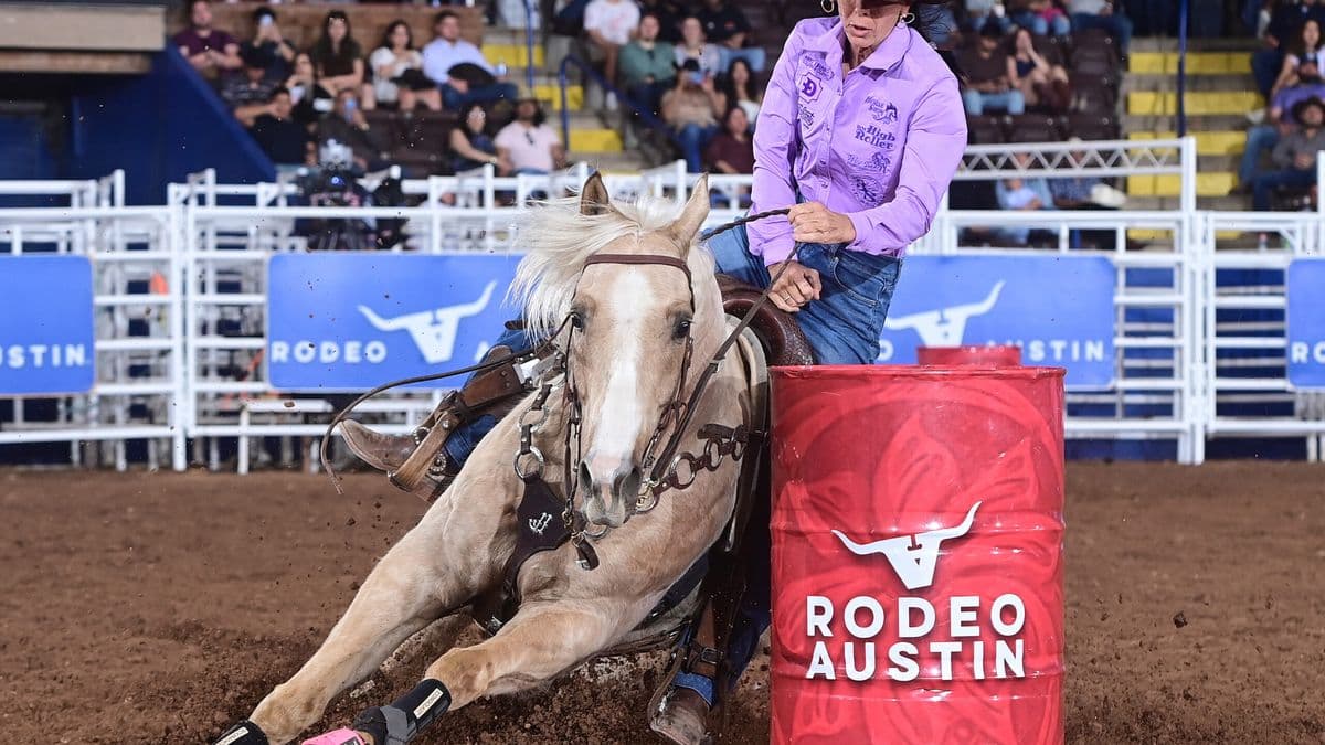 Latricia Duke and Carlos turn a red Rodeo Austin barrel