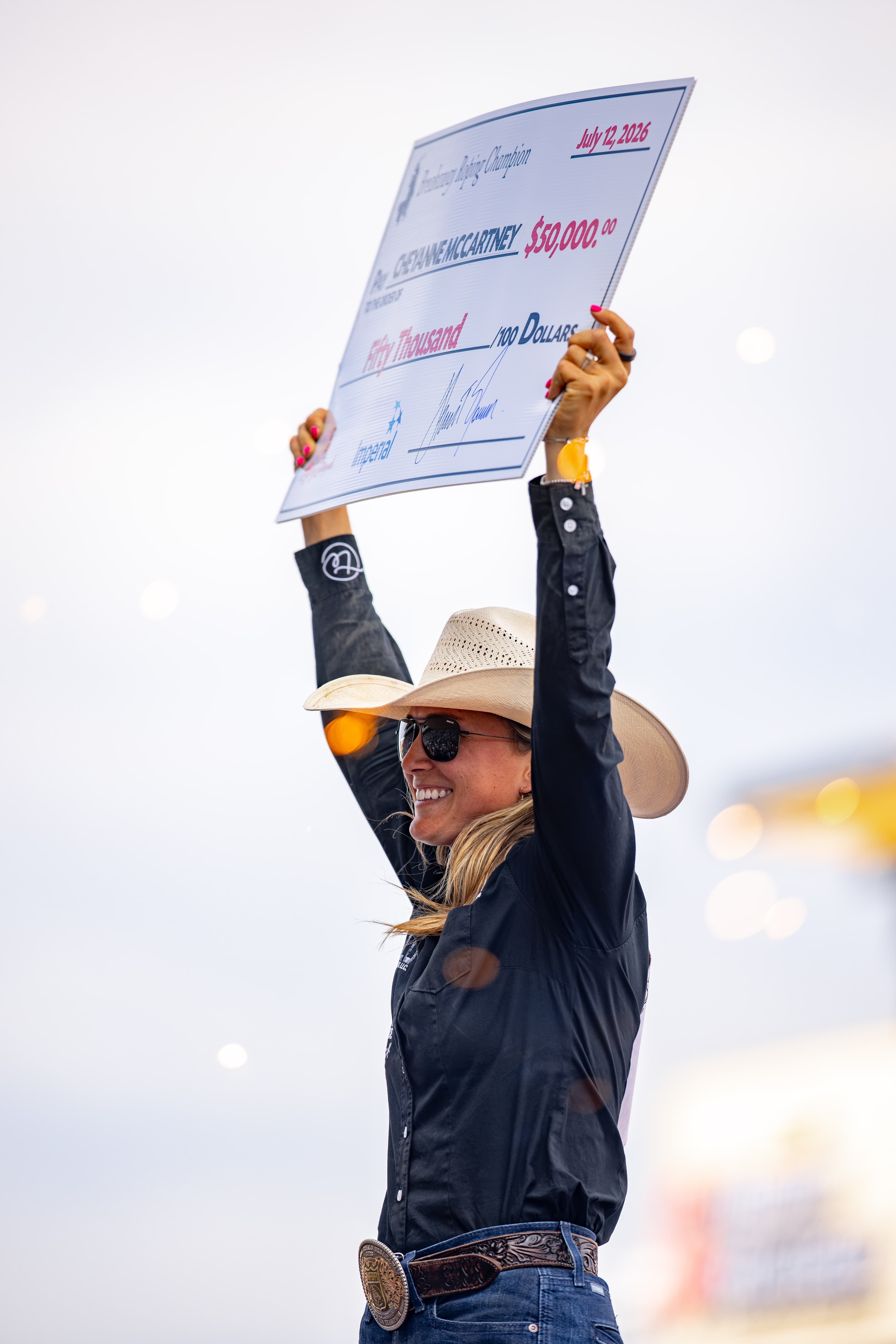 Cheyanne McCartney celebrates her $69,500 win at the 2026 Calgary Stampede, a check that moved her to No. 1 in the world. | Emily Gethke photo