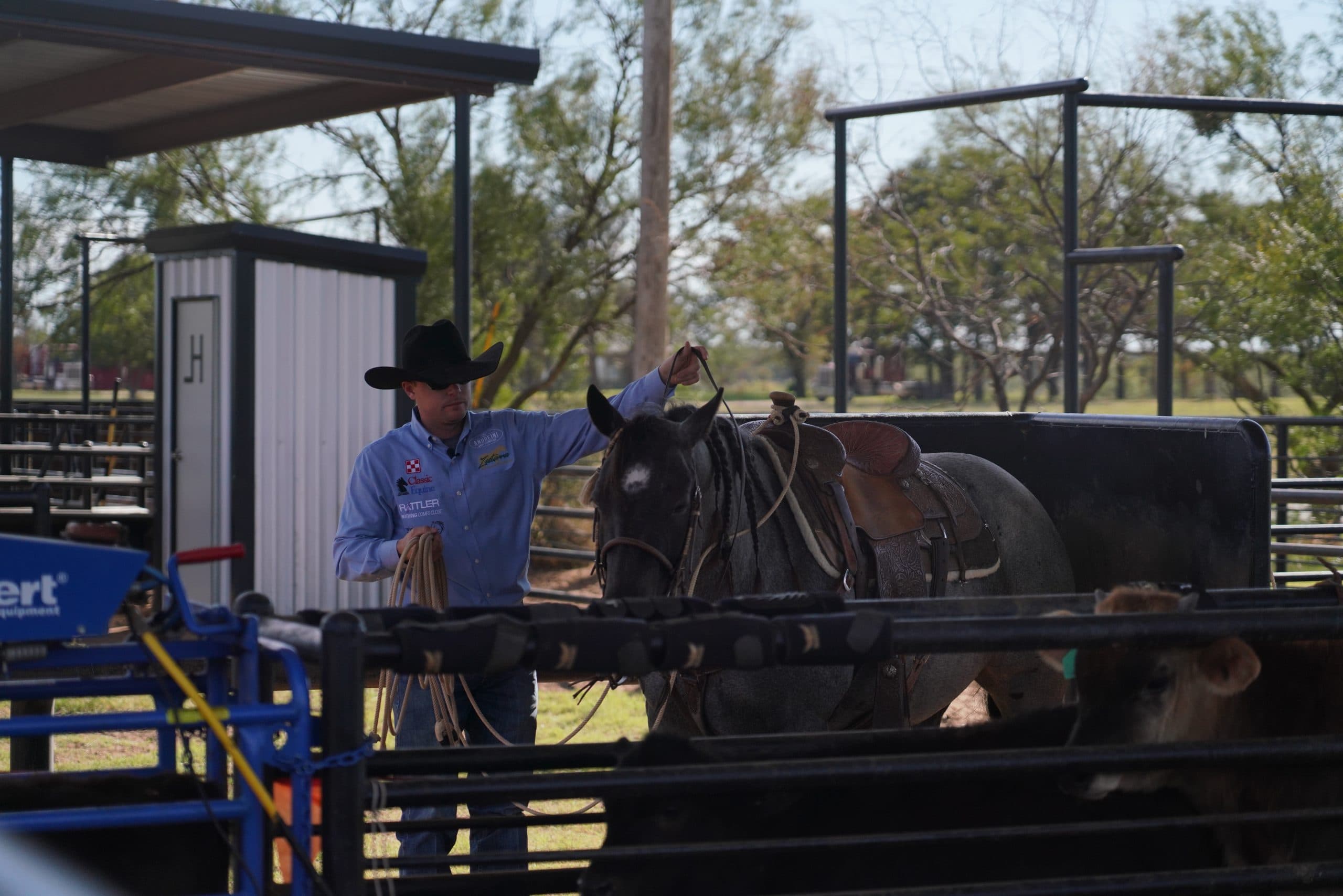 Essential Calf Roping Gear, Logan Harkey in box with horse