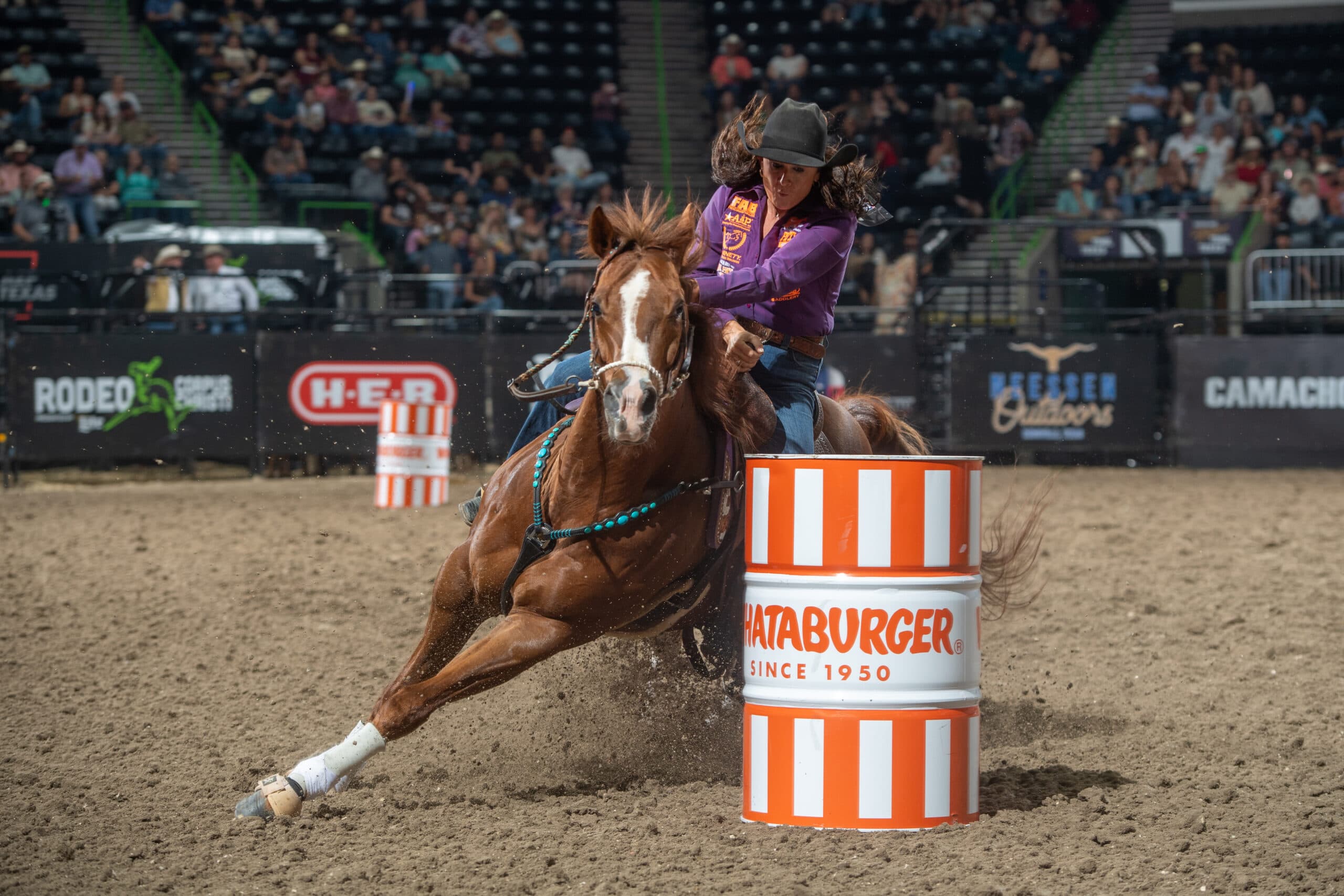 Stephanie Fryar turns a barrel on her horse