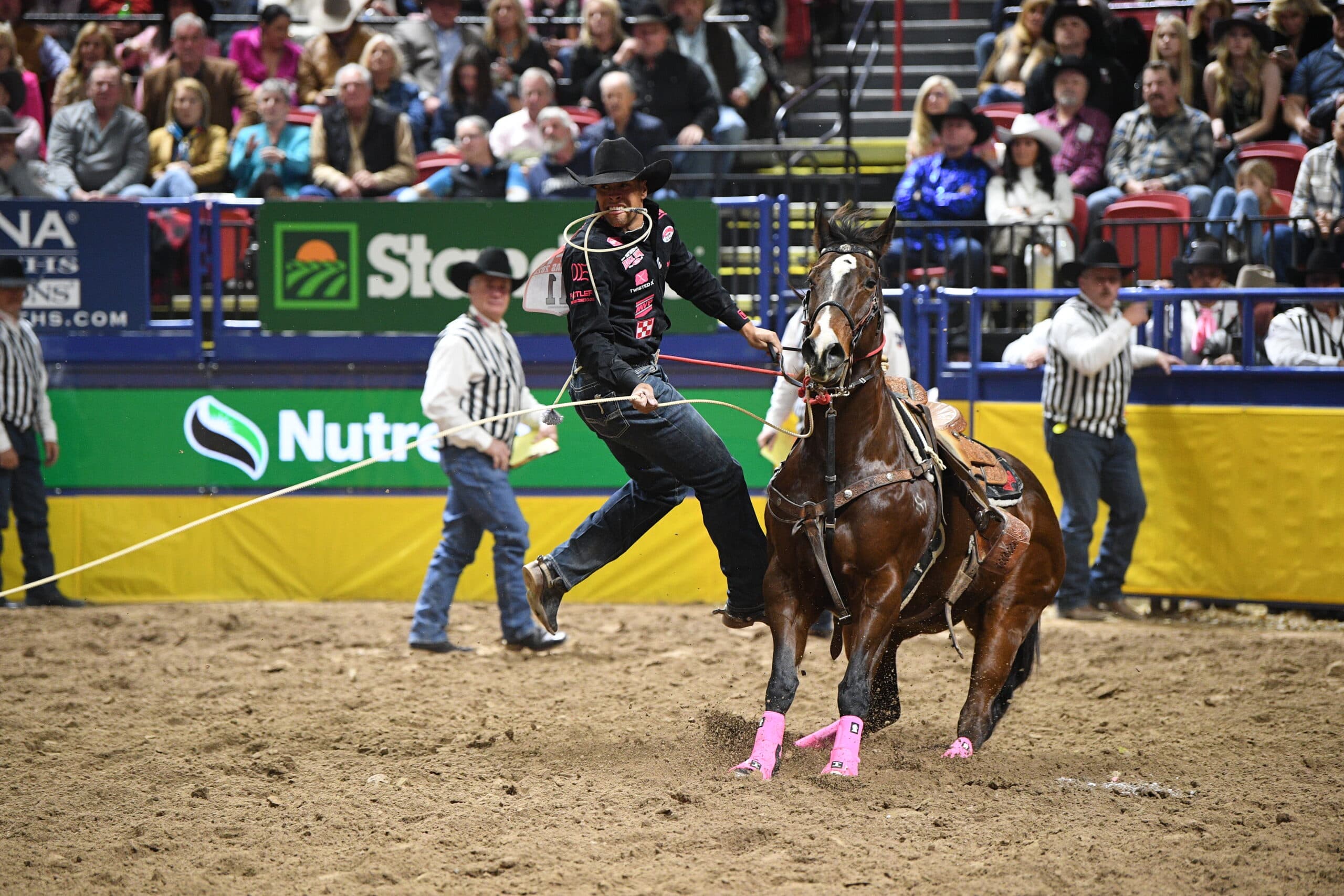 Shad Mayfield dismounts from mare "Lollipop" in Round 4.