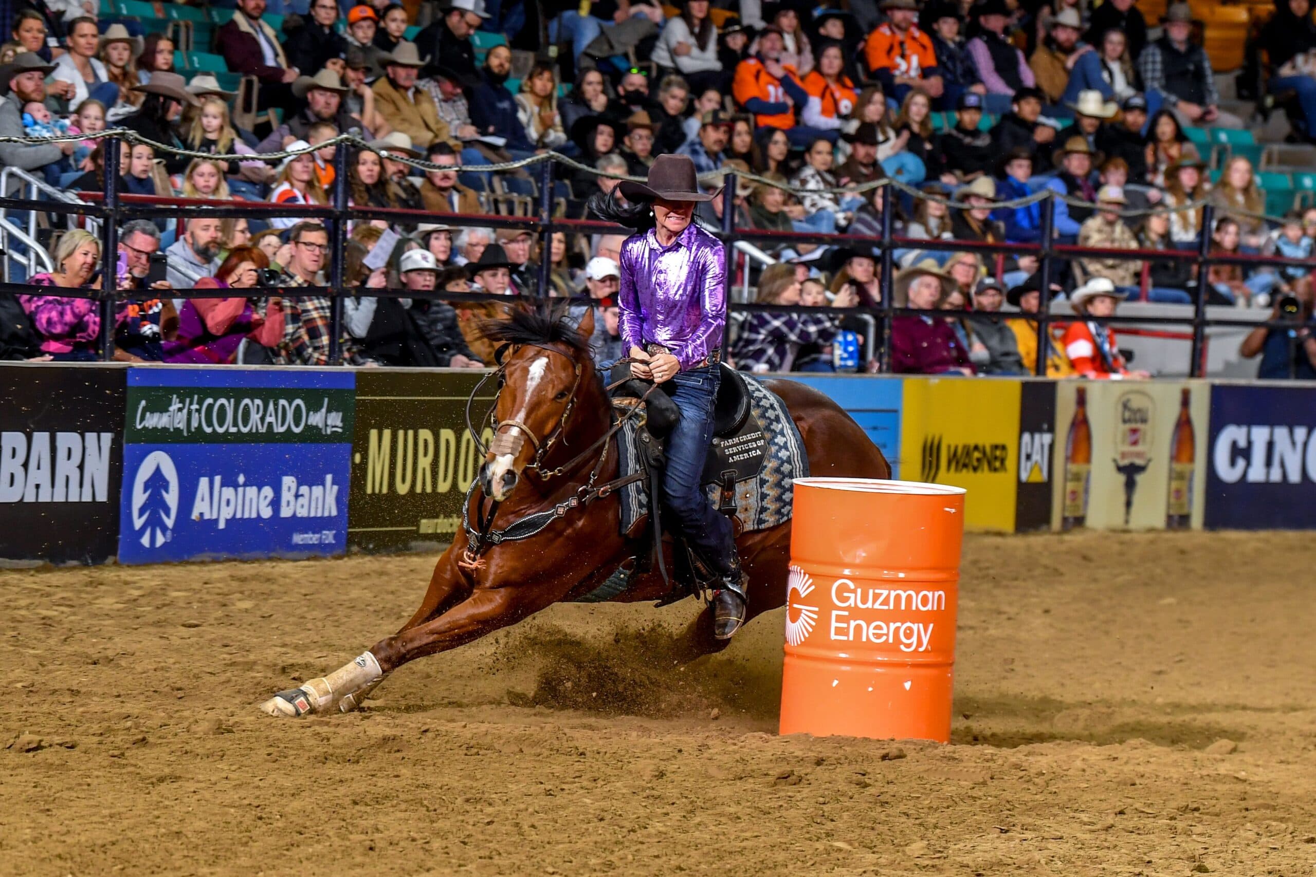 heidi gunderson turns a barrel on her horse