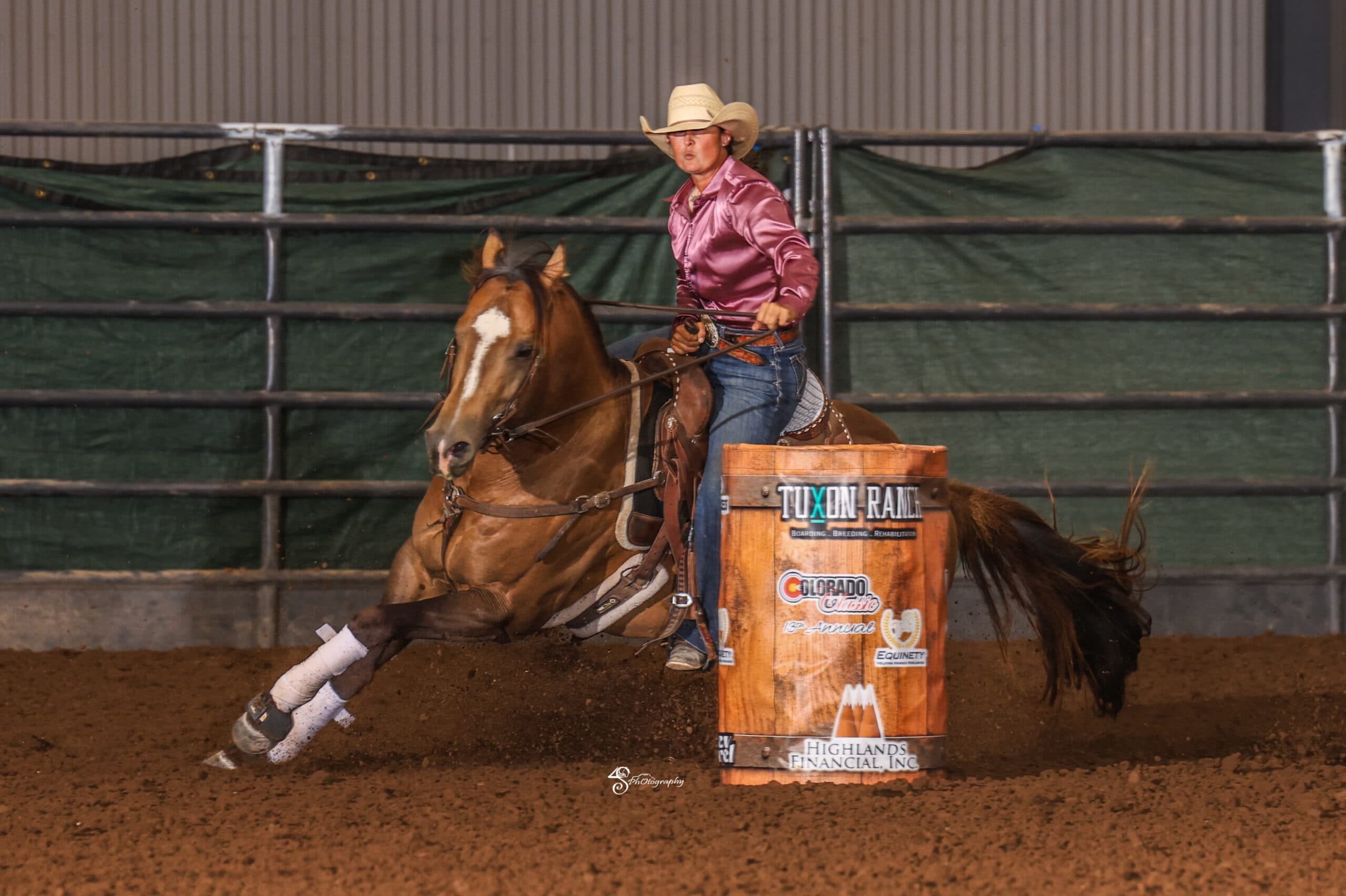 Taylor Langdon rounds a barrel on her stallion "Strutter"