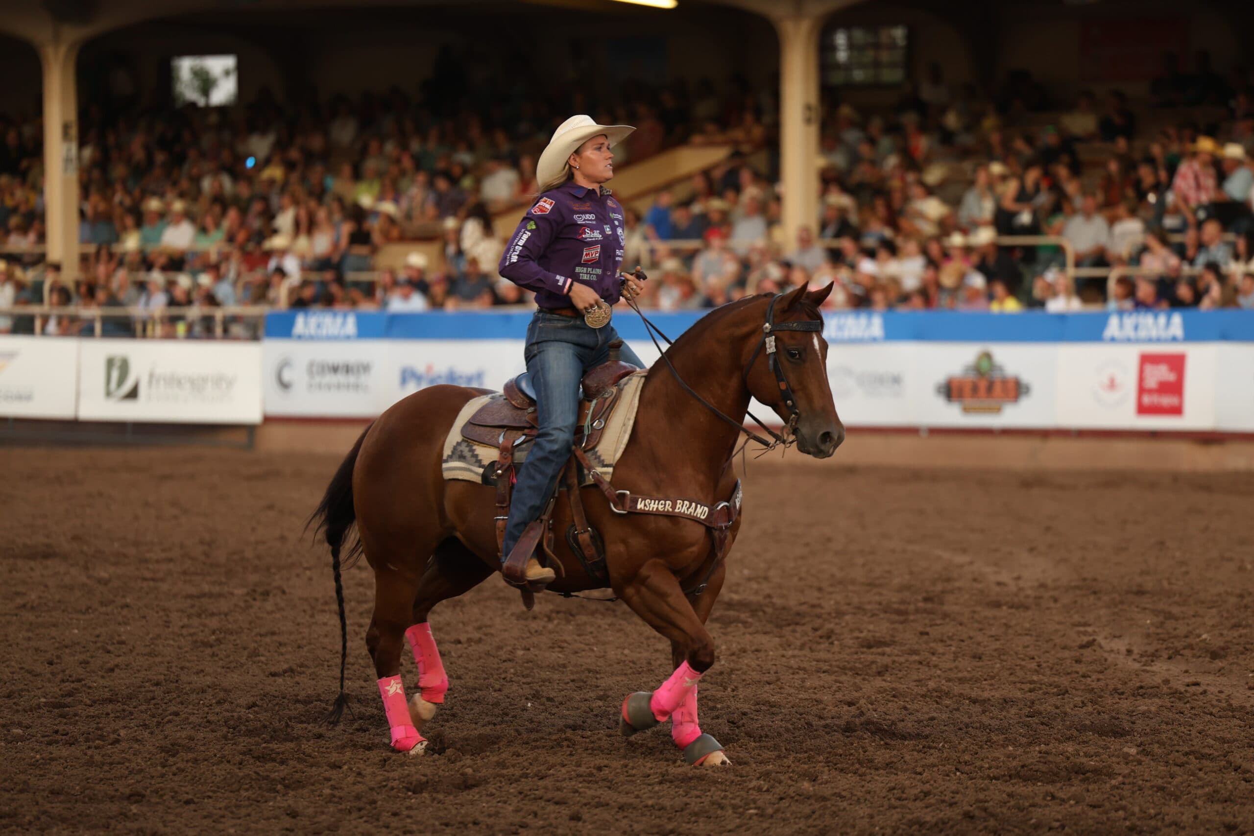 Taylor Munsell riding out of the arena after going 3.6 in round 2 of the NFR open to lead the average.