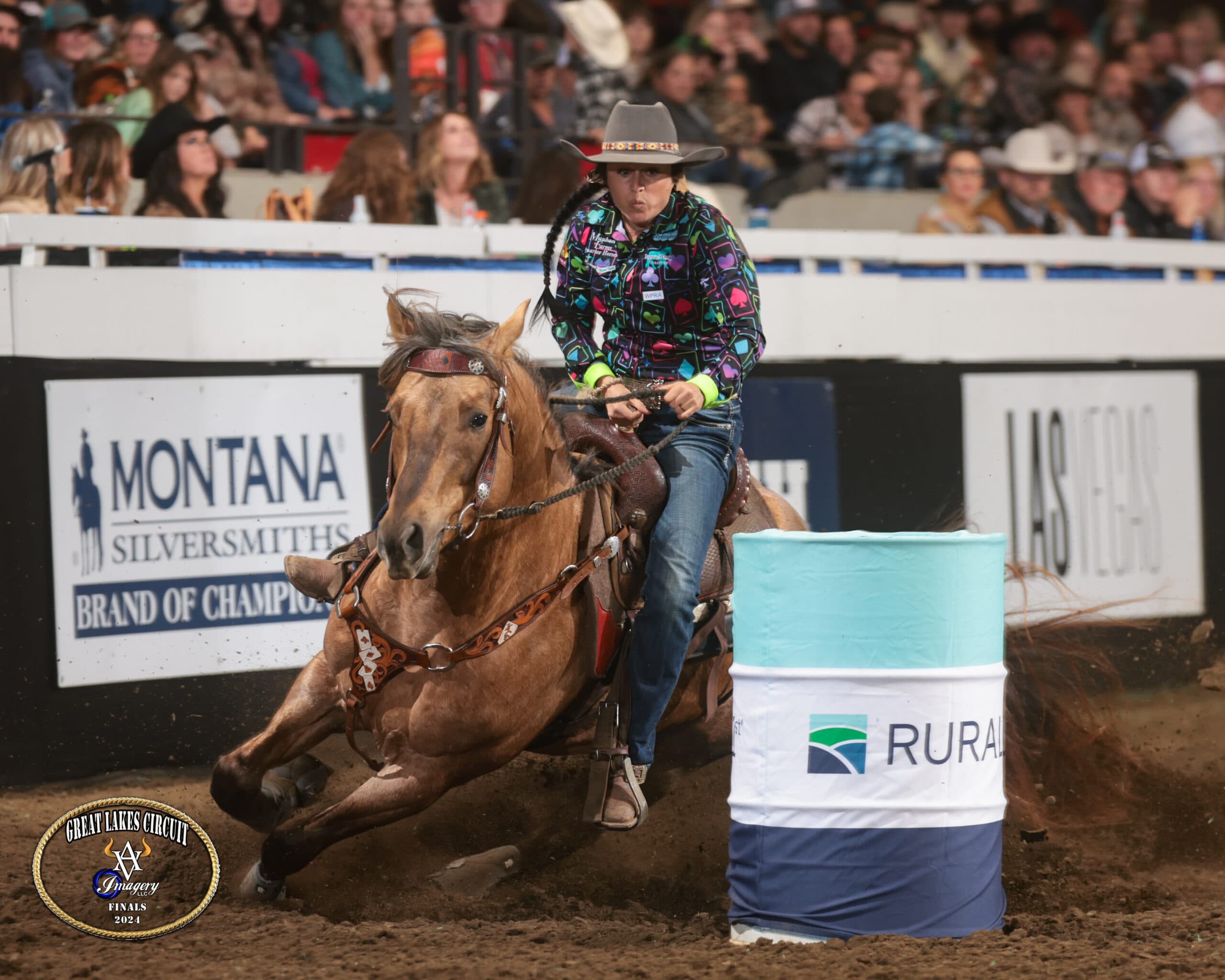 Katie Chism turns a barrel on her stallion