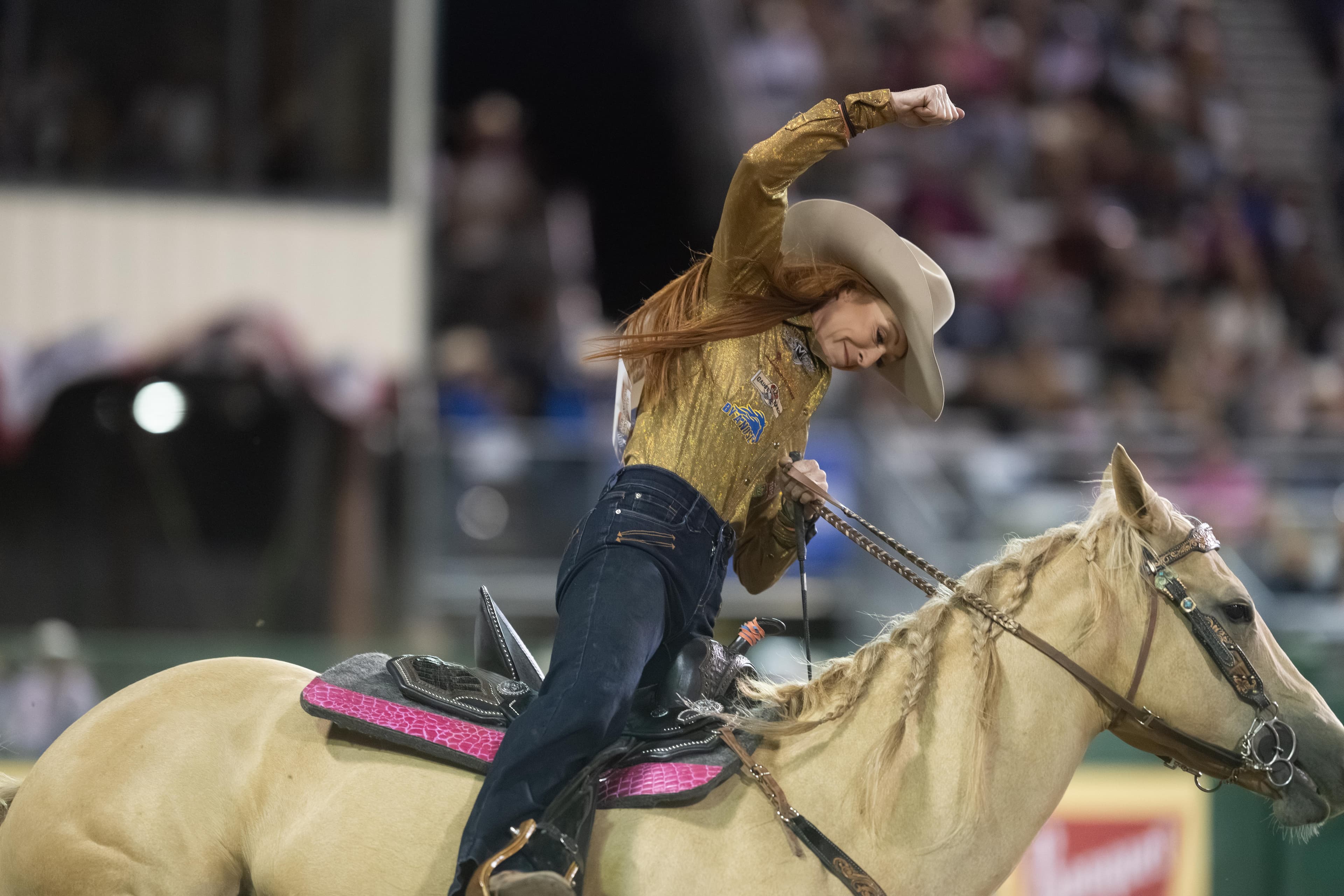 Emily Beisel fist pumps on her horse