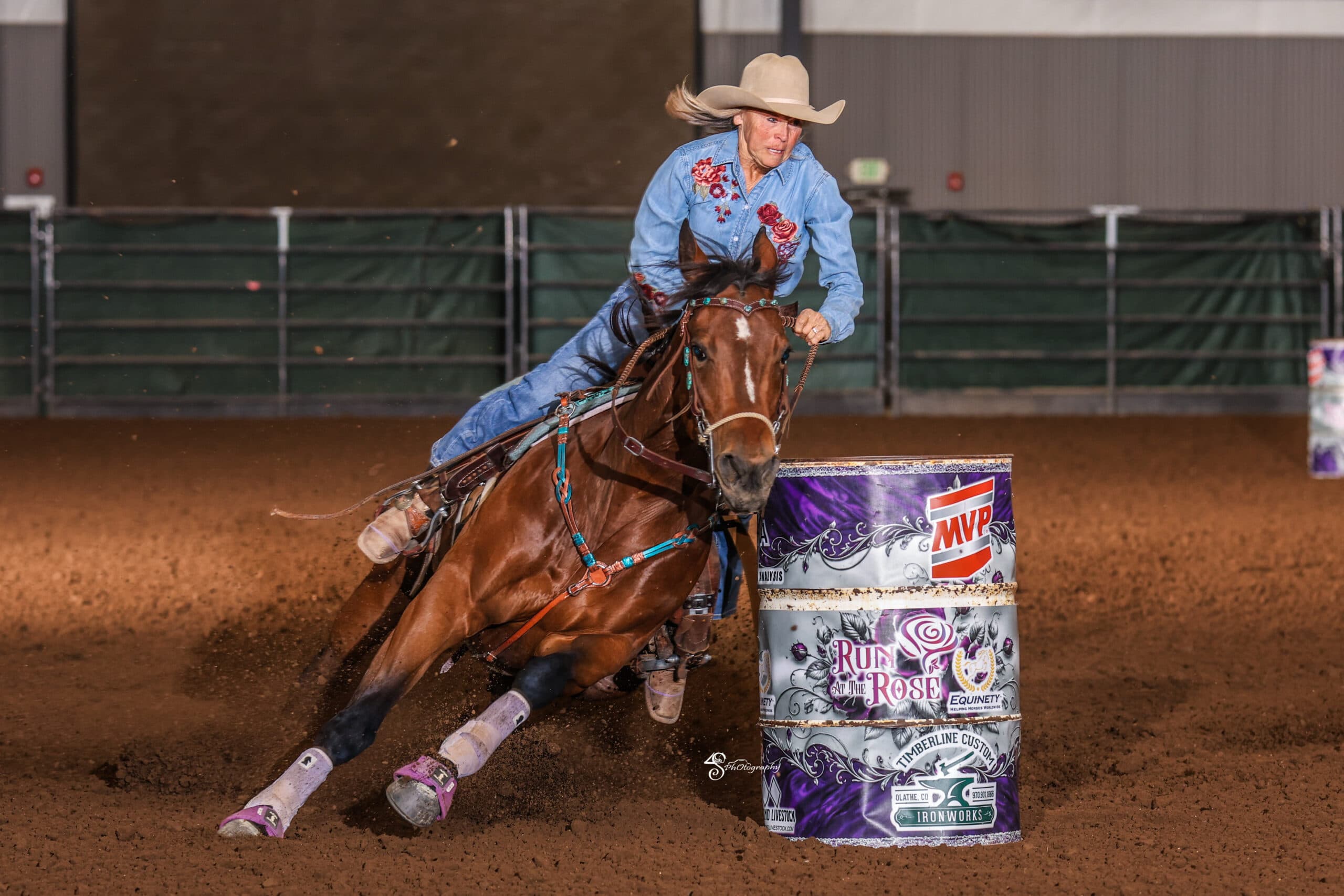 Kim Schulze turns a barrel on her dark horse