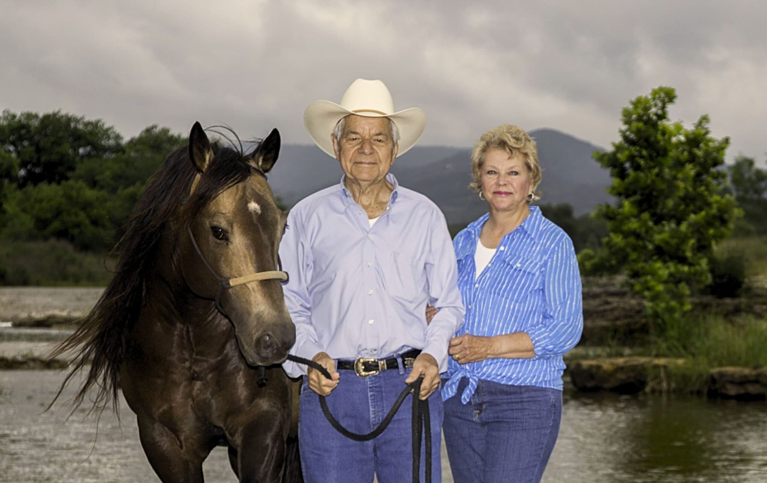 LA and Wanda Waters stand with Wild Card Dunit, the 2001 stallion that proved himself in the reined cowhorse and roping pen before heading to the breeding pasture to sire champions.