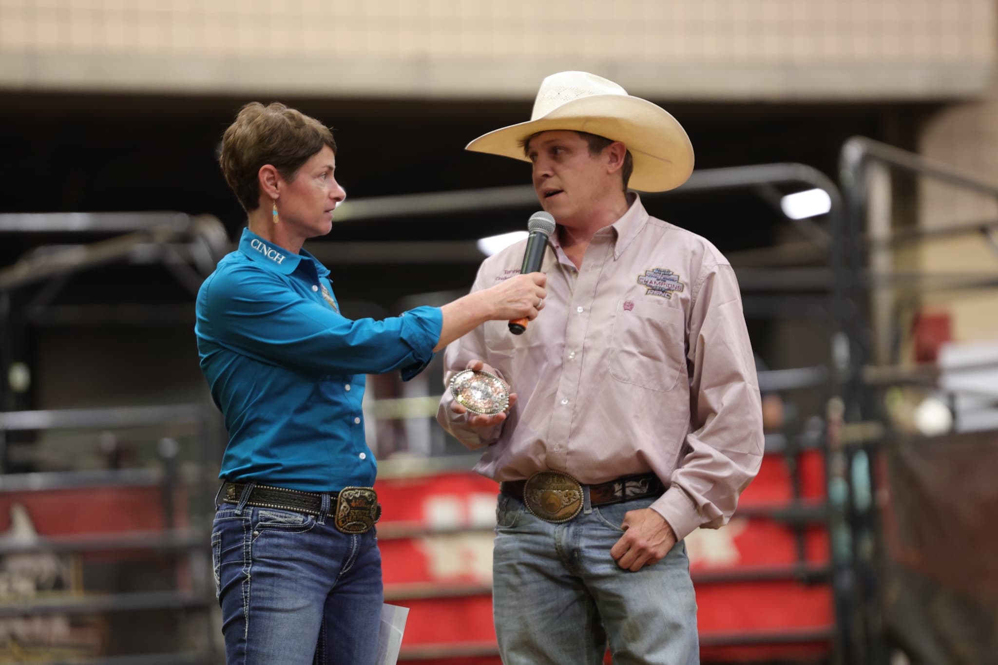 Tanner Keith holds his buckle during an interview after winning the Challenge of the Champions Open at the 2026 Cinch RSNC World Finals in Fort Worth