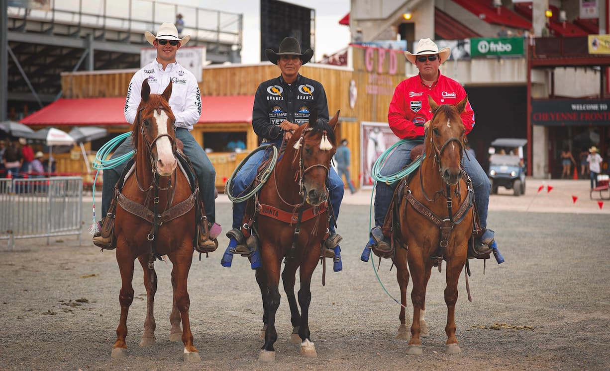 Korbin Rice, Derrick Begay and Cooper Feeman on horses, standing side by side, smiling at camera.