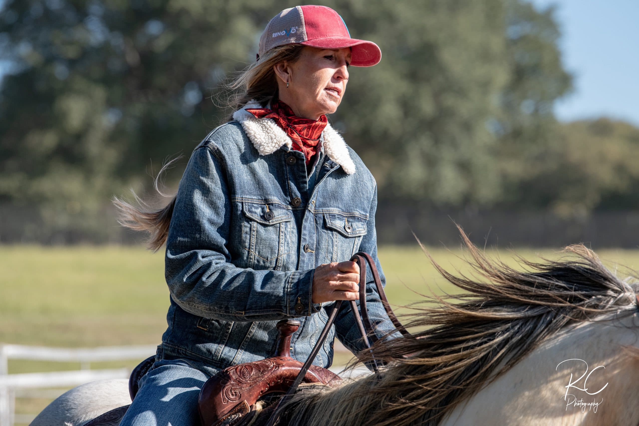 Cheyenne Wimberley loping a grey horse